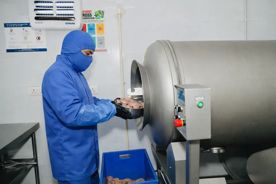 Chicken loaded into a vacuum tumbler